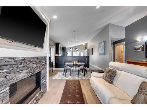 122 Sundown Close Se, Calgary, AB - Indoor Photo Showing Living Room With Fireplace