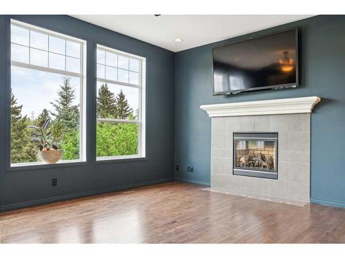 125 Valley Woods Place Nw, Calgary, AB - Indoor Photo Showing Living Room With Fireplace