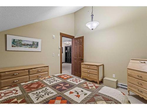 319-175 Crossbow Place, Canmore, AB - Indoor Photo Showing Bedroom