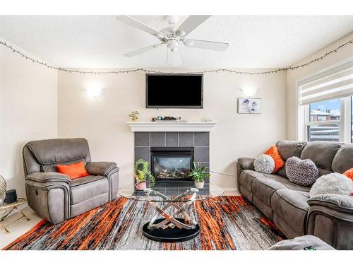 51 Saddlecrest Gardens Ne, Calgary, AB - Indoor Photo Showing Living Room With Fireplace