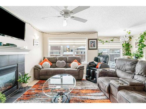 51 Saddlecrest Gardens Ne, Calgary, AB - Indoor Photo Showing Living Room With Fireplace