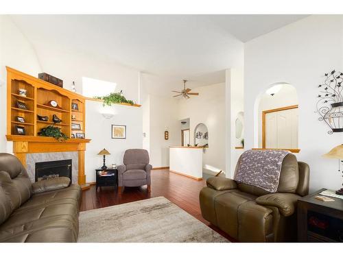 4 West Terrace Drive, Cochrane, AB - Indoor Photo Showing Living Room With Fireplace