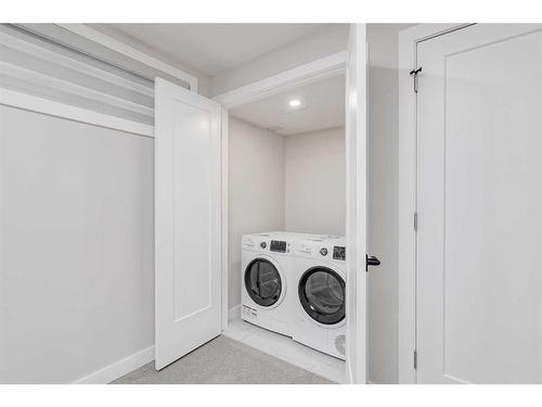 32 Hidden Way Nw, Calgary, AB - Indoor Photo Showing Laundry Room