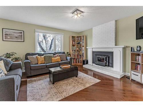 168 Dover Ridge Bay Se, Calgary, AB - Indoor Photo Showing Living Room With Fireplace