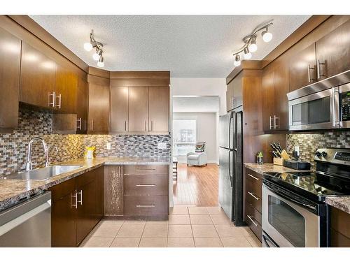 19 Erin Park Bay Se, Calgary, AB - Indoor Photo Showing Kitchen With Upgraded Kitchen