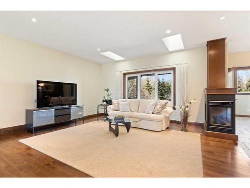 12 Wildflower Cove, Strathmore, AB - Indoor Photo Showing Living Room With Fireplace