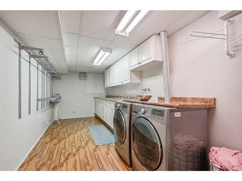 228 Pump Hill Gardens Sw, Calgary, AB - Indoor Photo Showing Laundry Room