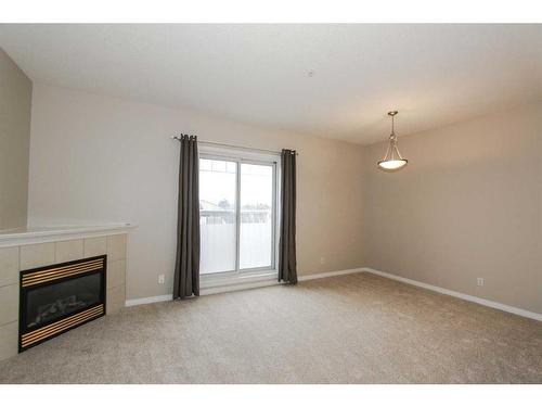 302-1905 Centre Street Nw, Calgary, AB - Indoor With Fireplace
