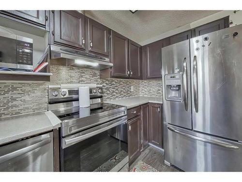 36 Falshire Close Ne, Calgary, AB - Indoor Photo Showing Kitchen With Stainless Steel Kitchen With Upgraded Kitchen