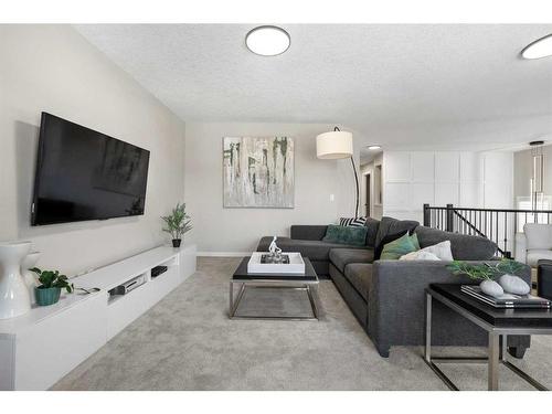 49 Cougar Ridge Close Sw, Calgary, AB - Indoor Photo Showing Living Room