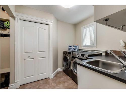 16 Coulee Park Sw, Calgary, AB - Indoor Photo Showing Laundry Room