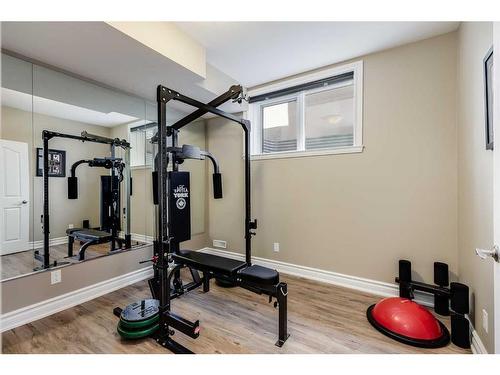 16 Coulee Park Sw, Calgary, AB - Indoor Photo Showing Gym Room