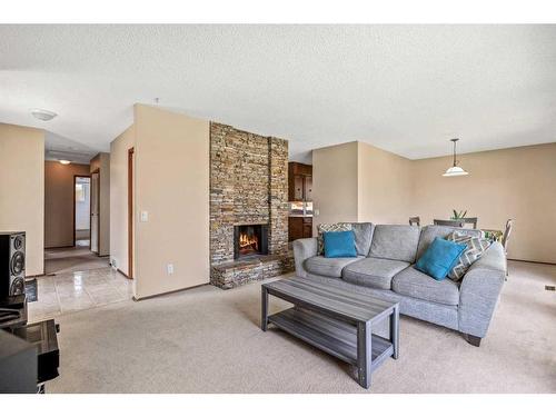 6423 Silver Ridge Drive Nw, Calgary, AB - Indoor Photo Showing Living Room With Fireplace