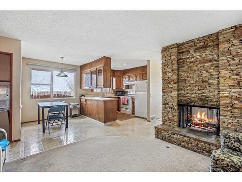 6423 Silver Ridge Drive Nw, Calgary, AB - Indoor Photo Showing Living Room With Fireplace