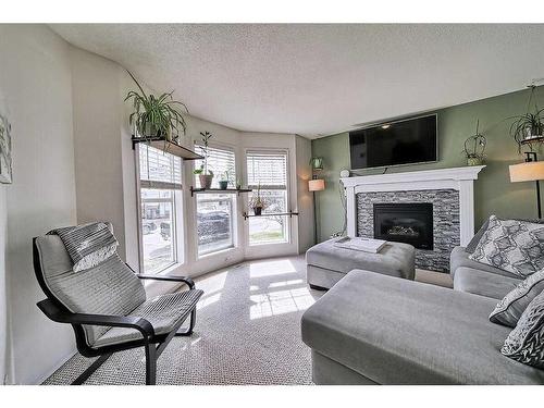 34 Cramond Crescent Se, Calgary, AB - Indoor Photo Showing Living Room With Fireplace
