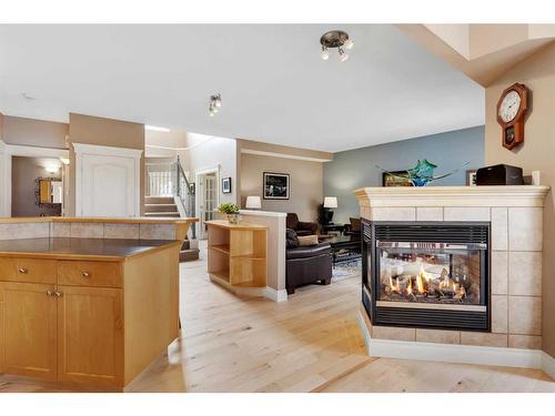 163 Strathridge Place Sw, Calgary, AB - Indoor With Fireplace