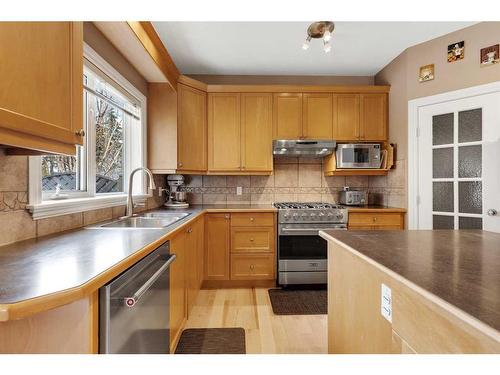 163 Strathridge Place Sw, Calgary, AB - Indoor Photo Showing Kitchen With Double Sink
