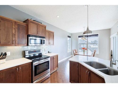104 Prestwick Manor Se, Calgary, AB - Indoor Photo Showing Kitchen With Double Sink