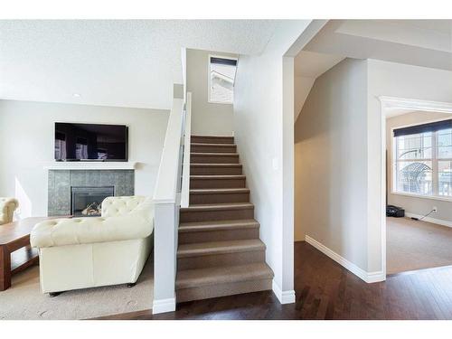 104 Prestwick Manor Se, Calgary, AB - Indoor With Fireplace