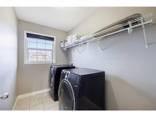 104 Prestwick Manor Se, Calgary, AB - Indoor Photo Showing Laundry Room