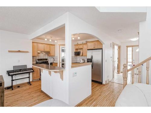 89 Cramond Crescent Se, Calgary, AB - Indoor Photo Showing Kitchen With Double Sink