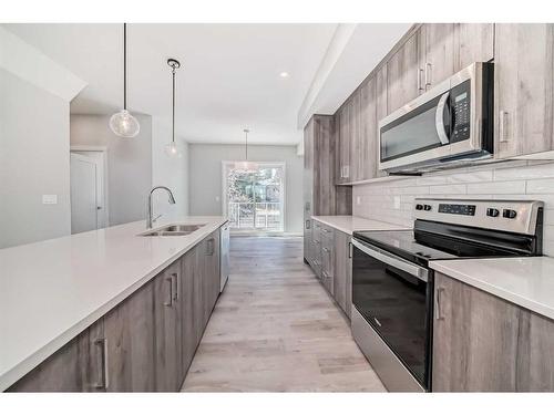 450 Shawnee Square Sw, Calgary, AB - Indoor Photo Showing Kitchen With Double Sink With Upgraded Kitchen