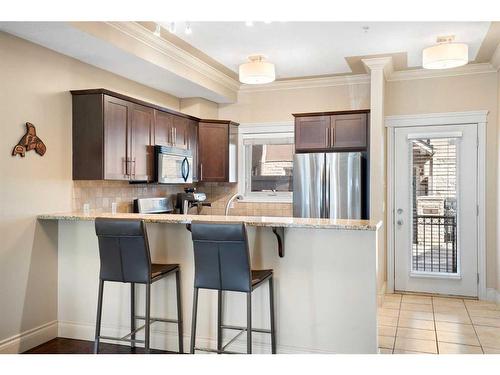 107-1728 35 Avenue Sw, Calgary, AB - Indoor Photo Showing Kitchen With Upgraded Kitchen