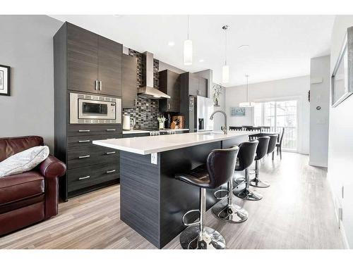 115-131 23 Avenue Ne, Calgary, AB - Indoor Photo Showing Kitchen With Upgraded Kitchen