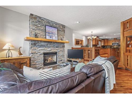 1-821 4Th Street, Canmore, AB - Indoor Photo Showing Living Room With Fireplace