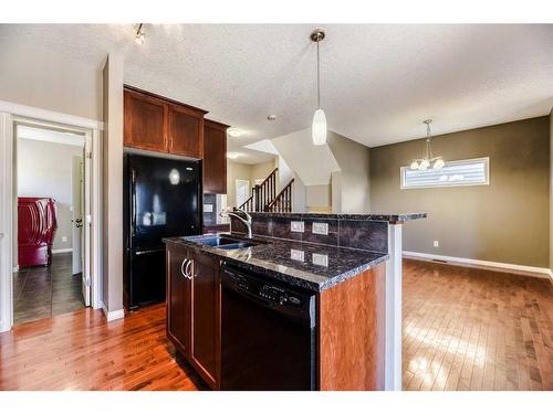 48 Silverado Saddle Court Sw, Calgary, AB - Indoor Photo Showing Kitchen With Double Sink