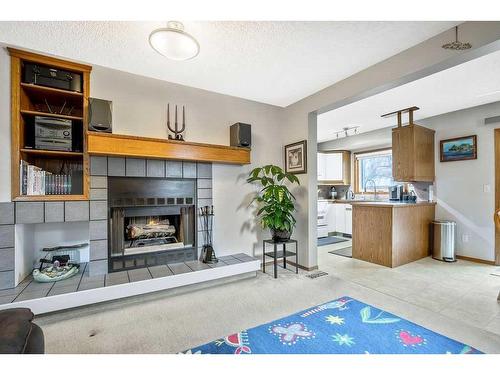 240 Shawinigan Place Sw, Calgary, AB - Indoor With Fireplace