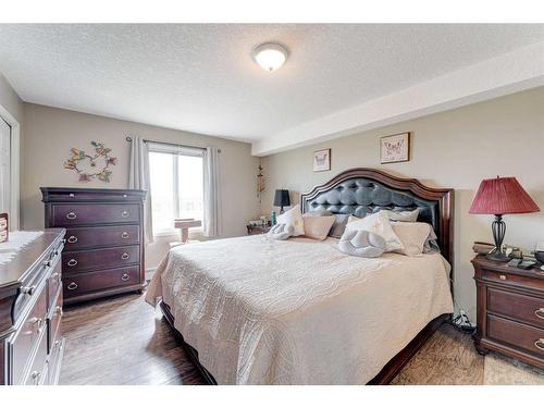 8429-304 Mackenzie Way Sw, Airdrie, AB - Indoor Photo Showing Bedroom
