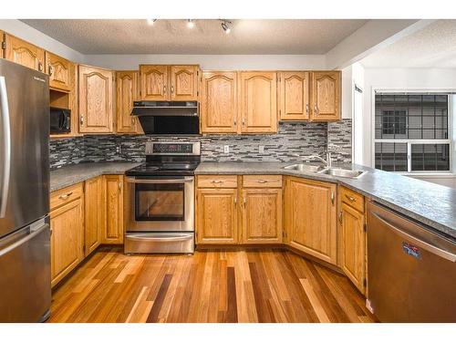 26 Silvergrove Close Nw, Calgary, AB - Indoor Photo Showing Kitchen With Double Sink