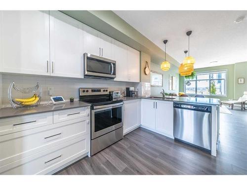 12-138 Seton Passage Se, Calgary, AB - Indoor Photo Showing Kitchen With Stainless Steel Kitchen With Upgraded Kitchen