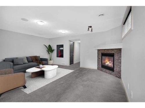 193 Cranford Drive Se, Calgary, AB - Indoor Photo Showing Living Room With Fireplace