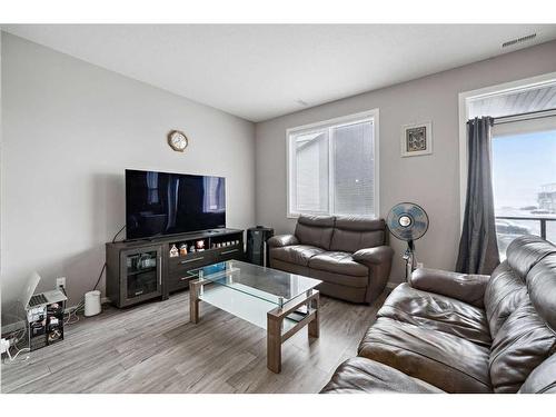 204-215 Redstone Walk Ne, Calgary, AB - Indoor Photo Showing Living Room