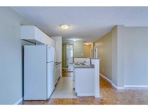 414-1040 15 Avenue Sw, Calgary, AB - Indoor Photo Showing Kitchen With Double Sink