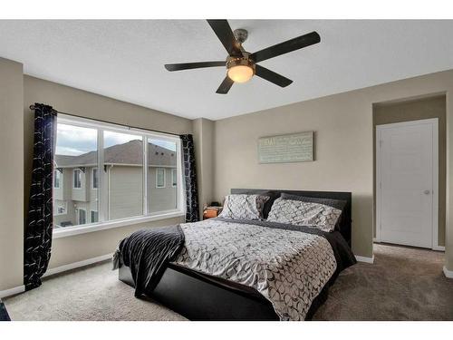 248 Sunset Point, Cochrane, AB - Indoor Photo Showing Bedroom