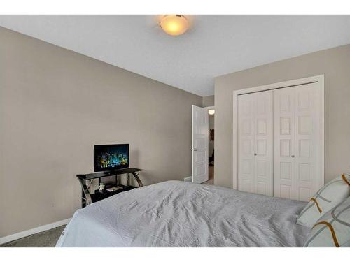 248 Sunset Point, Cochrane, AB - Indoor Photo Showing Bedroom