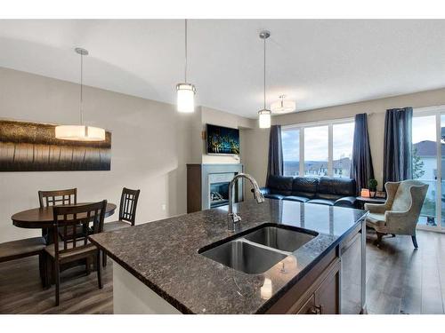 248 Sunset Point, Cochrane, AB - Indoor Photo Showing Kitchen With Double Sink