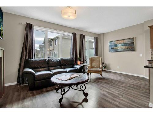 248 Sunset Point, Cochrane, AB - Indoor Photo Showing Living Room
