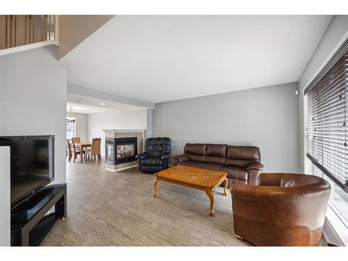 141 Prestwick Park Se, Calgary, AB - Indoor Photo Showing Living Room With Fireplace