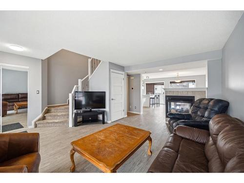 141 Prestwick Park Se, Calgary, AB - Indoor Photo Showing Living Room With Fireplace