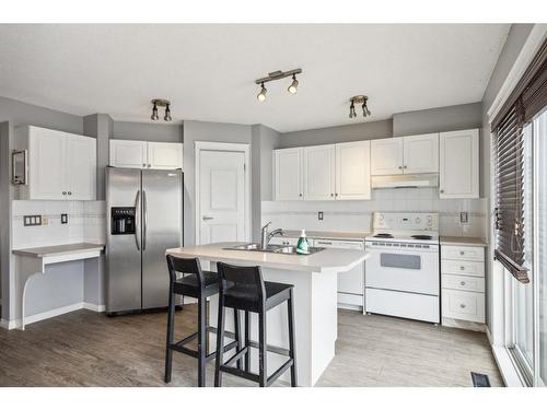 141 Prestwick Park Se, Calgary, AB - Indoor Photo Showing Kitchen With Double Sink