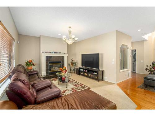 193 Chapala Drive Se, Calgary, AB - Indoor Photo Showing Living Room With Fireplace