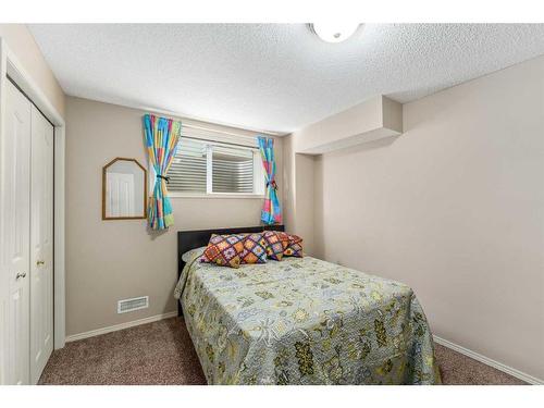 193 Chapala Drive Se, Calgary, AB - Indoor Photo Showing Bedroom