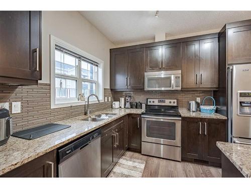 71 Evansridge Court, Calgary, AB - Indoor Photo Showing Kitchen With Stainless Steel Kitchen With Double Sink