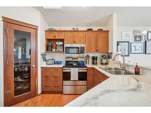 163 Cranberry Way Se, Calgary, AB - Indoor Photo Showing Kitchen With Double Sink