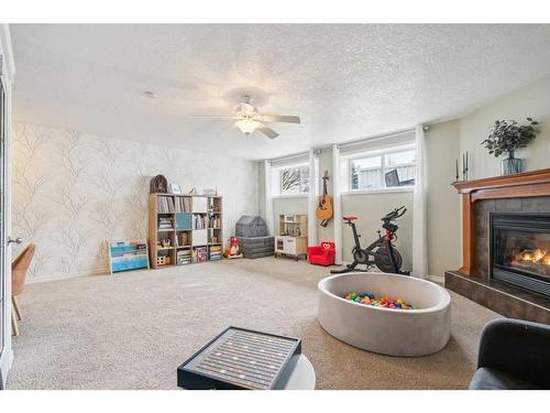 163 Cranberry Way Se, Calgary, AB - Indoor With Fireplace