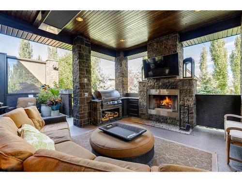 145 Chapala Point Se, Calgary, AB - Outdoor With Fireplace With Deck Patio Veranda With Exterior
